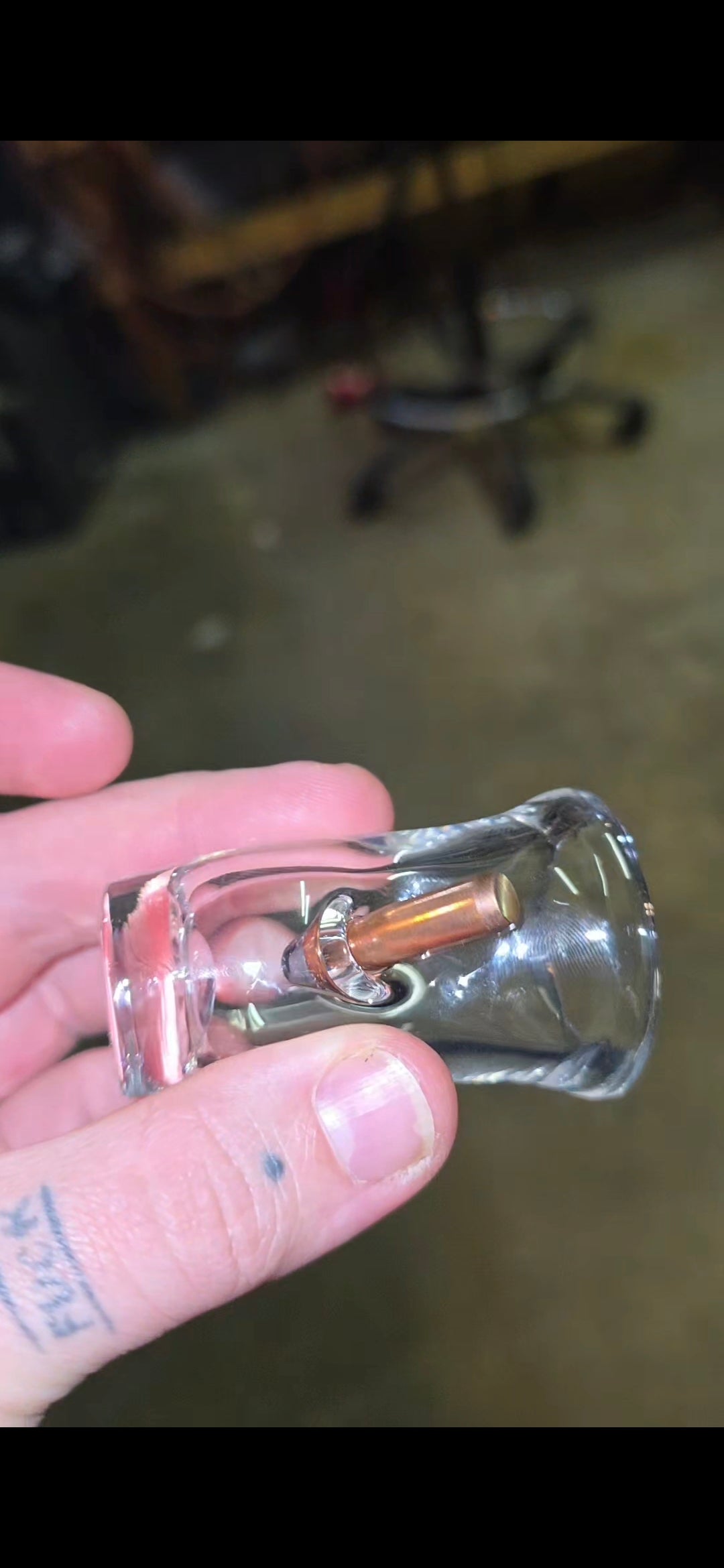 Shotglass with bullet and millie