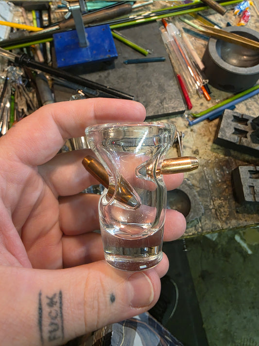 Shotglass with 2 bullets